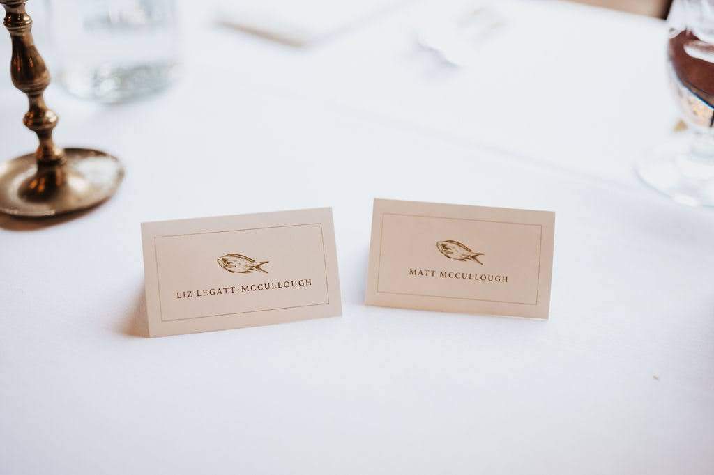 Cards on a table describing the catered food
